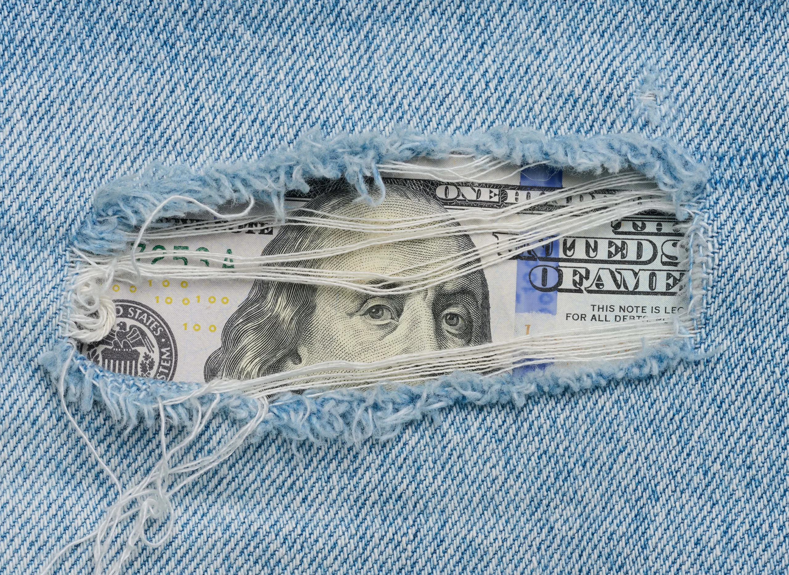 Hundred_Dollar_Bill_Under_A_Jeans_original_1698900-min-scaled